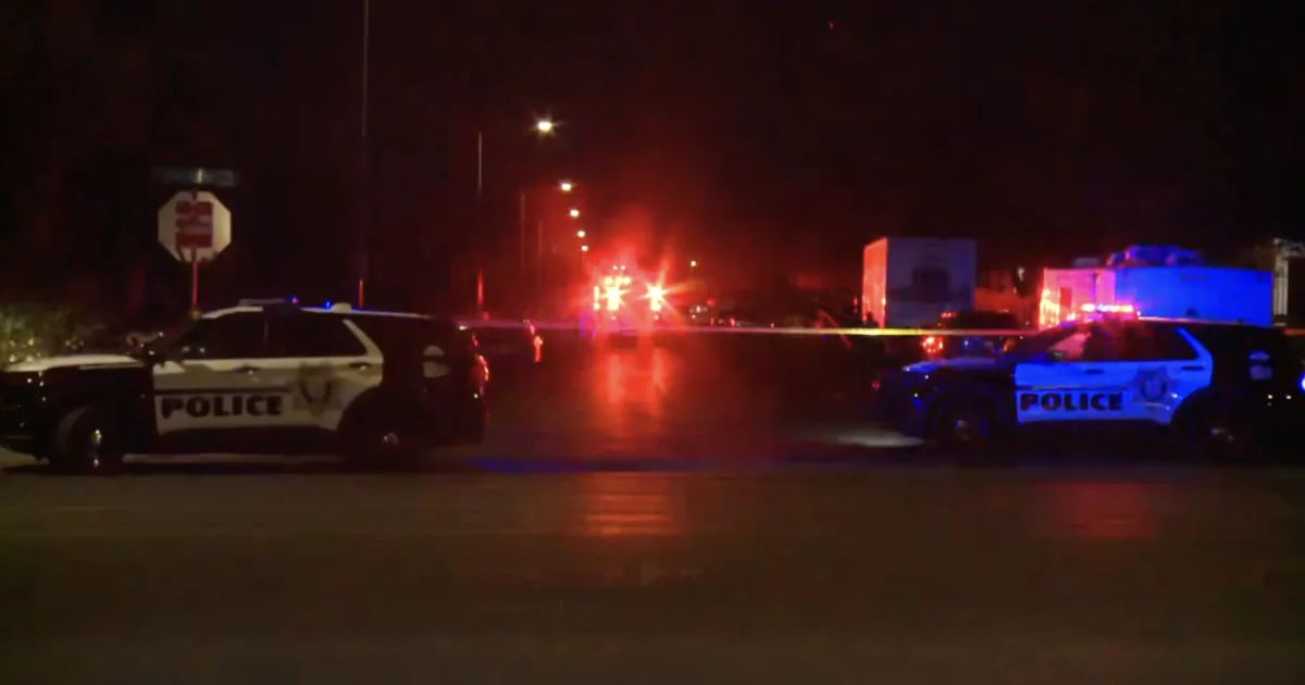 Police officers and SWAT vehicles responding to a barricade near a Las Vegas neighborhood