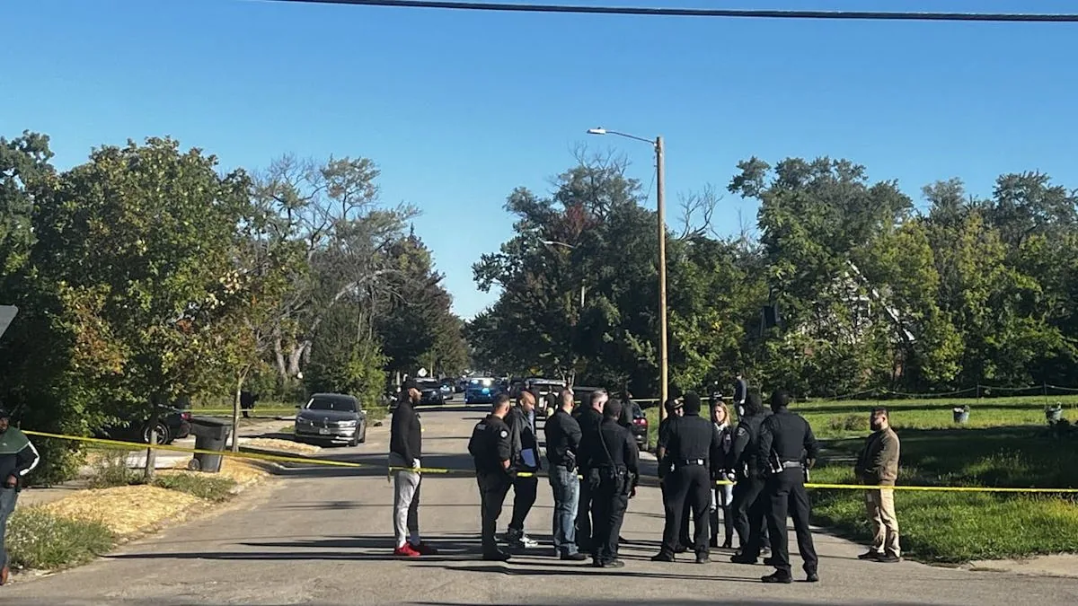 Detroit police at a Prest Street home after a shooting that killed three people