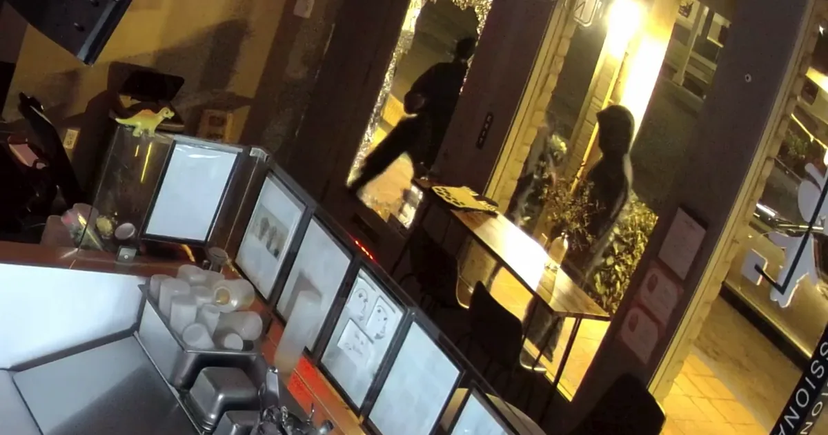 Broken storefront window at a Pleasanton shopping center after a smash-and-grab burglary
