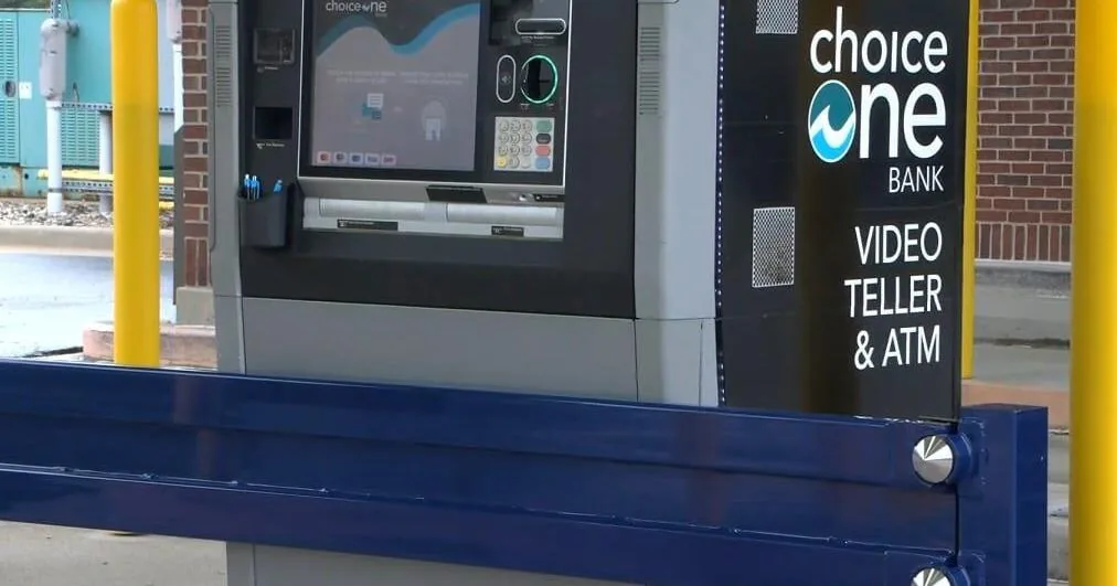 ChoiceOne Bank in Fenton with a blue barrier in front of the ATM area
