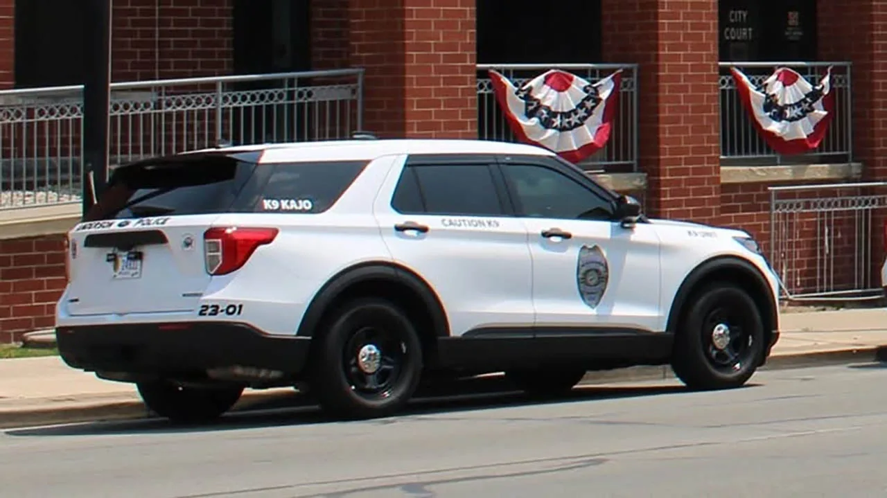 Anderson police car near Poplar Street after a reported robbery and gunfire investigation