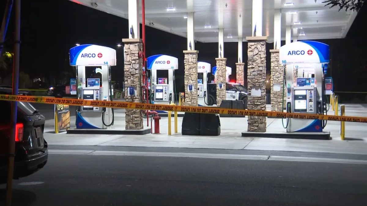 Sheriff's deputies investigate a homicide scene near an ampm and Better Buzz in Vista